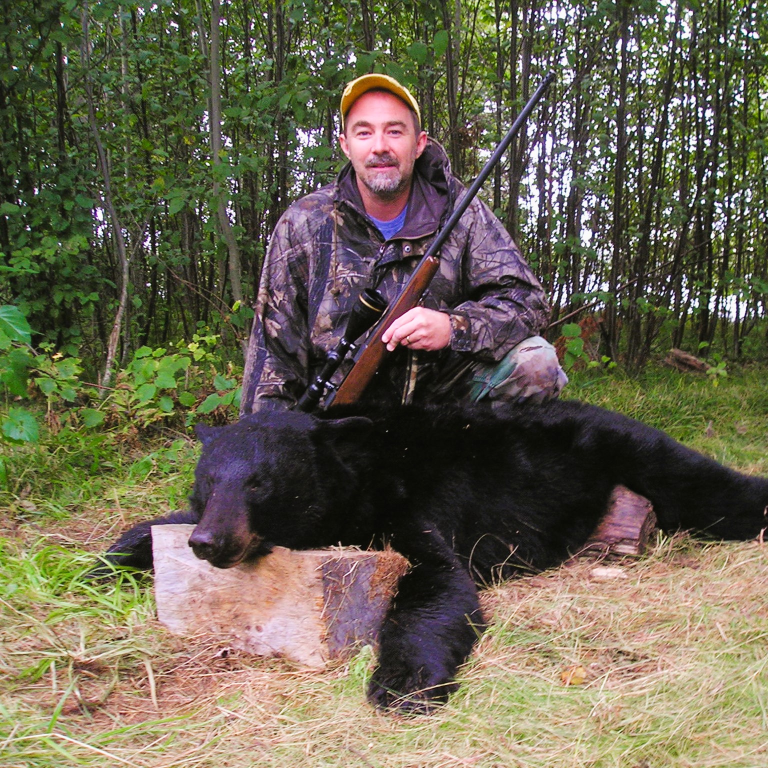 firearm bear hunter with black bear