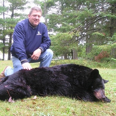 bear hunter with black bear
